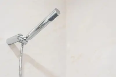 a shower head with a shower curtain at Papa 1T · Papa Studio Central Garden View in Porto