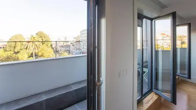 a balcony with a view of a city at Stylish Studio w/ AC & Balcony by LovelyStay in Porto