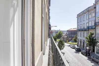 a view of a street from a balcony of a building at Artistic 2BR Flat Downtown w/ AC by LovelyStay in Porto