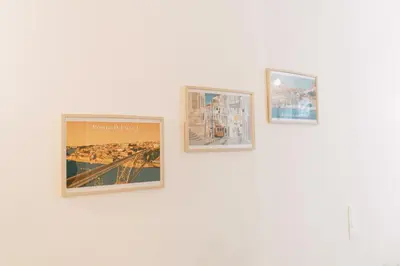 a group of four pictures on a white wall at Casa Burguesa Rua do Almada - Porto city center in Porto