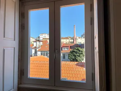 a window with a view of a city at Santo António Charming Flat in Porto