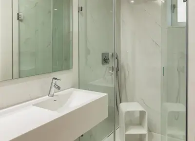 a white bathroom with a sink and a shower at Porto River Infante in Porto