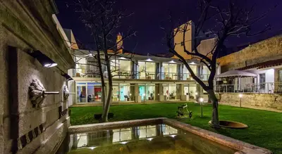 an external view of a building at night at Oca Vitoria Village in Porto