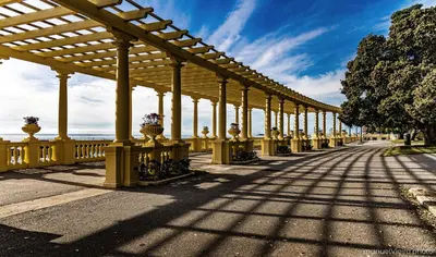 a long yellow bridge with columns and a fence at Rolé Douro - Almada 340 in Porto