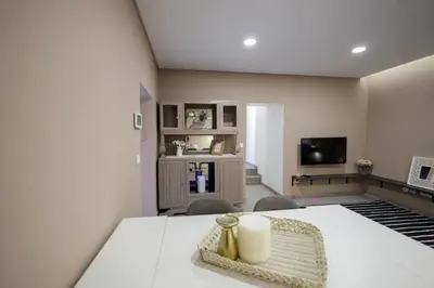 a living room with a couch and a table at Birds Apartments in Porto