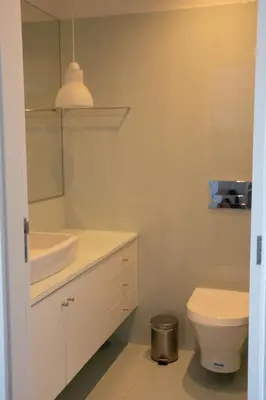 a white bathroom with a sink and a toilet at North Star Flats @Santa Marinha in Vila Nova de Gaia