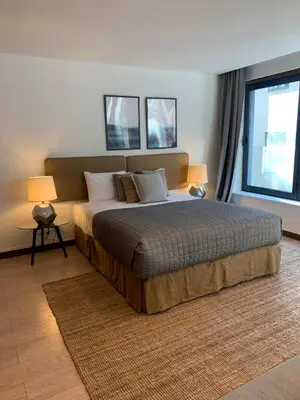 a bedroom with a large bed and two windows at Oporto Chic & Cozy - Oliveiras in Porto