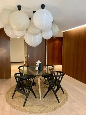 a glass table and chairs in a room with lights at Oporto Chic & Cozy - Oliveiras in Porto