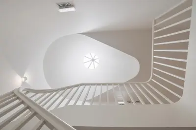 a spiral staircase in a building at InBloom Apartments in Porto