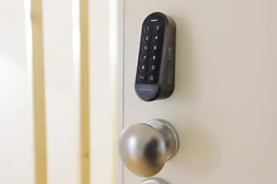 a door with a remote control on it at InBloom Apartments in Porto