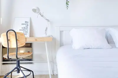 a bedroom with a desk next to a bed at Travel & Live Alegria Apartments in Porto