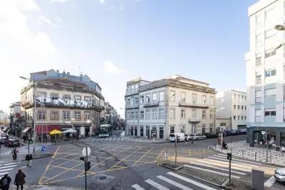 a city street with buildings and a crosswalk at Cute & Bright Flat w/ AC by LovelyStay in Porto