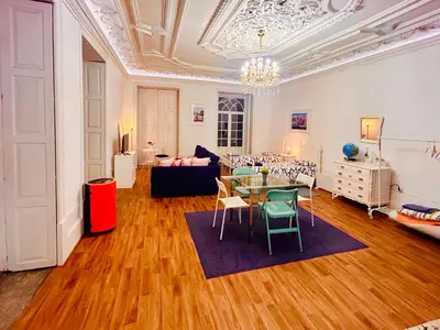 a large living room with a table and chairs at Oporto Blue Aliados - Historic City Center Studio in Porto