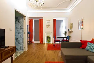 a living room with a couch and a table at Oporto Blue Cedofeita - Charming Citycenter Loft in Porto