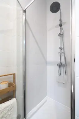 a shower with a glass door in a bathroom at Gaya Avenue Flats - Elegant Contemporary Flats with Balcony in Vila Nova de Gaia