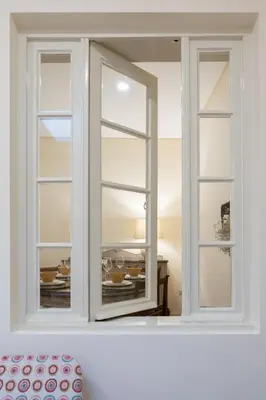a window in a white room with a table at Gaya Avenue Flats - Elegant Contemporary Flats with Balcony in Vila Nova de Gaia