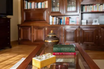 a coffee table with books on it in a living room at Preciosa Apartment by MP in Vila Nova de Gaia