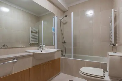 a bathroom with a sink and a toilet and a shower at Preciosa Apartment by MP in Vila Nova de Gaia