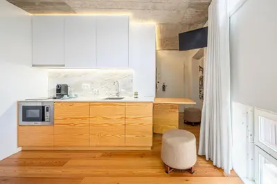 a kitchen with a sink and a microwave at Porta Nobre Boutique Hotel by Aspasios in Porto