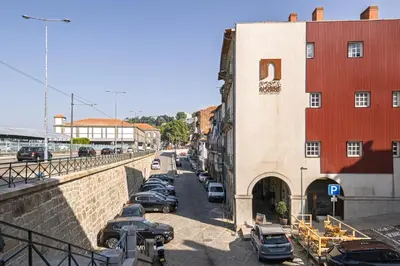 a city street with cars parked next to a building at Porta Nobre Boutique Hotel by Aspasios in Porto