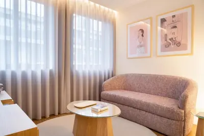 a living room with a couch and a table at Catarina Serviced Apartments by HostWise in Porto