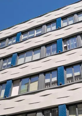 a facade of a building with blue windows at Catarina Serviced Apartments by HostWise in Porto