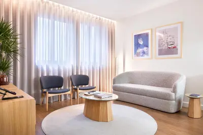 a living room with a couch and a chair at Catarina Serviced Apartments by HostWise in Porto