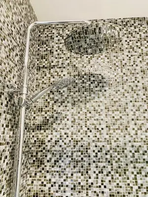 a shower with black and white tiles in a bathroom at Douro Eiffel Bridge Amazing View in Vila Nova de Gaia