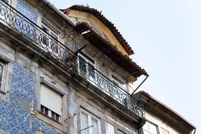 an old building with balconies on the side of it at Ribeira Loft in Porto
