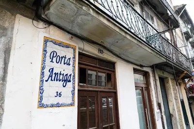 a sign on the side of a building at Ribeira Loft in Porto