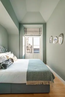 a bedroom with a bed and a window at Liberty 119 • Luxurious 1BD in Porto's main Avenue in Porto