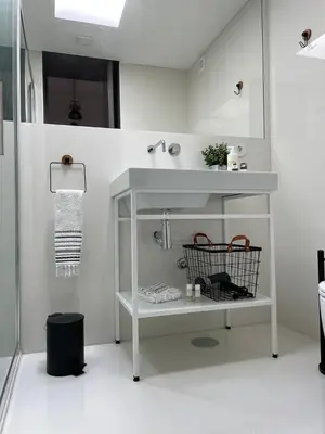 a white bathroom with a sink and a shower at GET a train and city view in Porto
