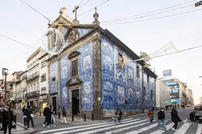 a building covered in blue tiles on the side of a street at Downtown Studio w/ AC & Patio by LovelyStay in Porto