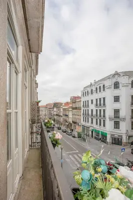 a balcony with a view of a city street at Liiiving in Porto - Ribeira Secret Apartment in Porto