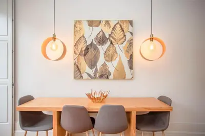 a dining room with a wooden table and chairs at Liiiving in Porto - Ribeira Secret Apartment in Porto