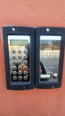 a pay phone is attached to a wall at MY DOURO VIEW Luxury Apartment River Front in Vila Nova de Gaia