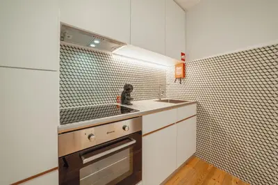a kitchen with a sink and a counter top at River Eyes Apartments in Porto