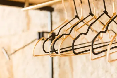 a group of metal racks hanging from a wall at In Between Exclusive Charm Apartment by the center in Porto