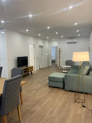 a living room with a couch and a television at ORM- Flores Apartment in Porto