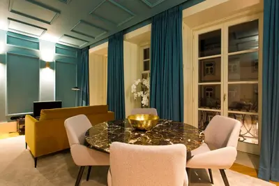 a dining room with a table and chairs at BOUTIQUE Rentals-Kinga’s Ribeira River great views in Porto