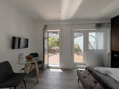 a living room with a couch and a table at Almada Studios & Suites in Porto