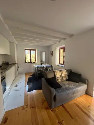a living room with a couch and a table at OPORTO WINE LOFTS in Vila Nova de Gaia