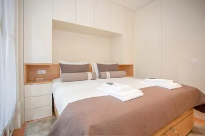 a bedroom with a large bed with towels on it at Liiiving in Porto - Cedofeita Charming Apartment in Porto