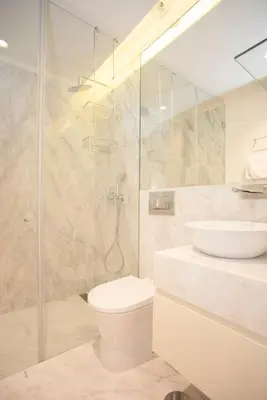 a bathroom with a shower and a toilet and a sink at Liiiving in Porto - Cedofeita Charming Apartment in Porto