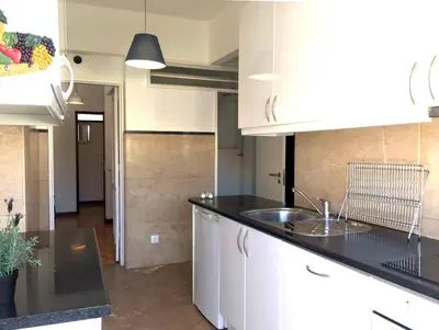 a kitchen with a sink and a counter top at PinPorto City Center III in Porto