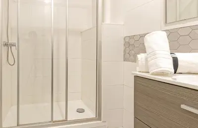 a bathroom with a shower and a sink at Luxury Prime Batalha Apartments in Porto