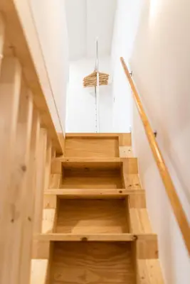 a staircase in a house with wooden steps at Alvaro's Charming Loft by MP in Vila Nova de Gaia