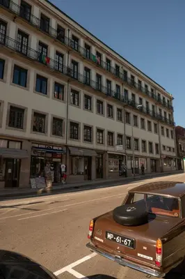 a brown car parked in front of a building at Blue Moon Studio in Porto