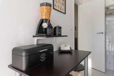 a kitchen with a table with a printer on it at PortoVivo Quental Terrace in Porto