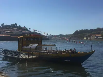 a group of people on a boat in the water at PortoVivo Quental Terrace in Porto